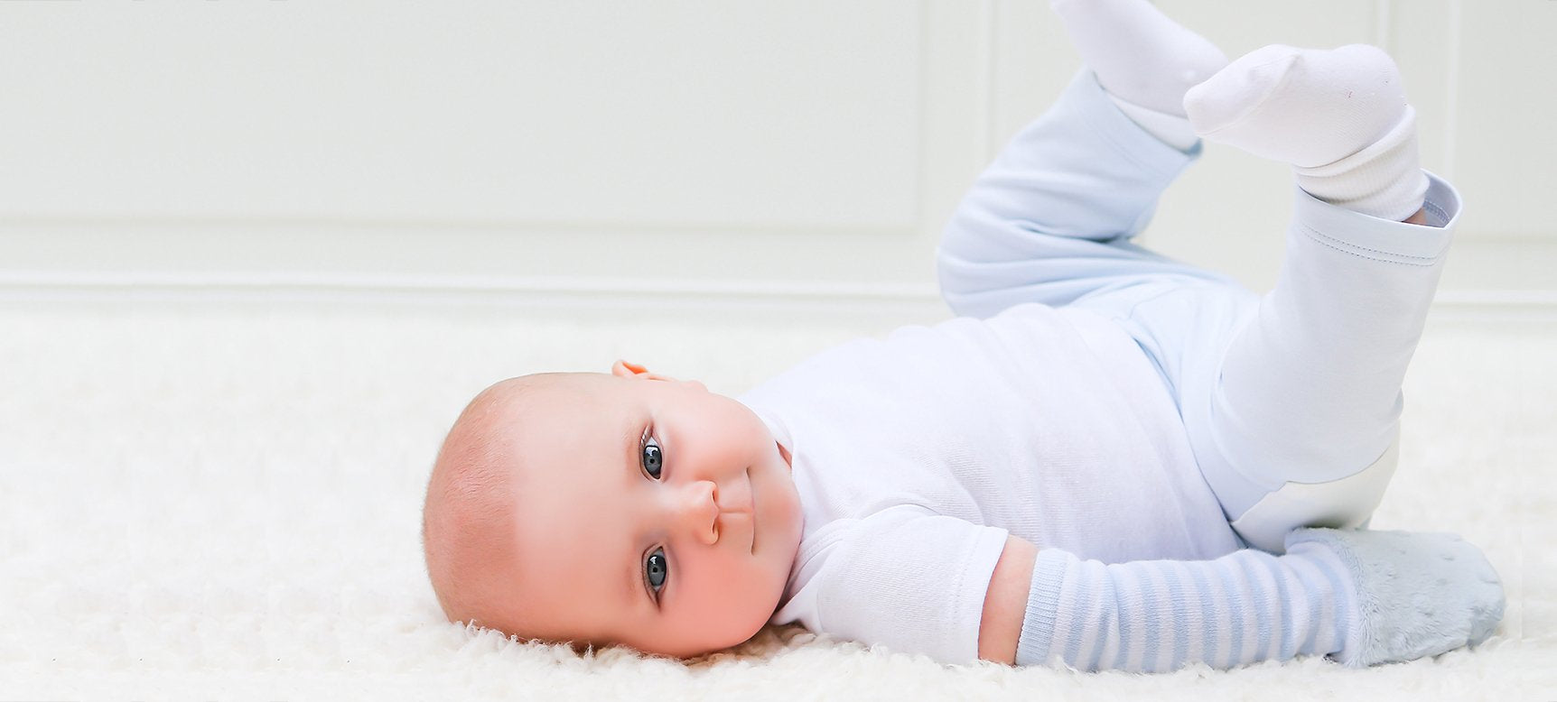 Baby with Handsocks laying down